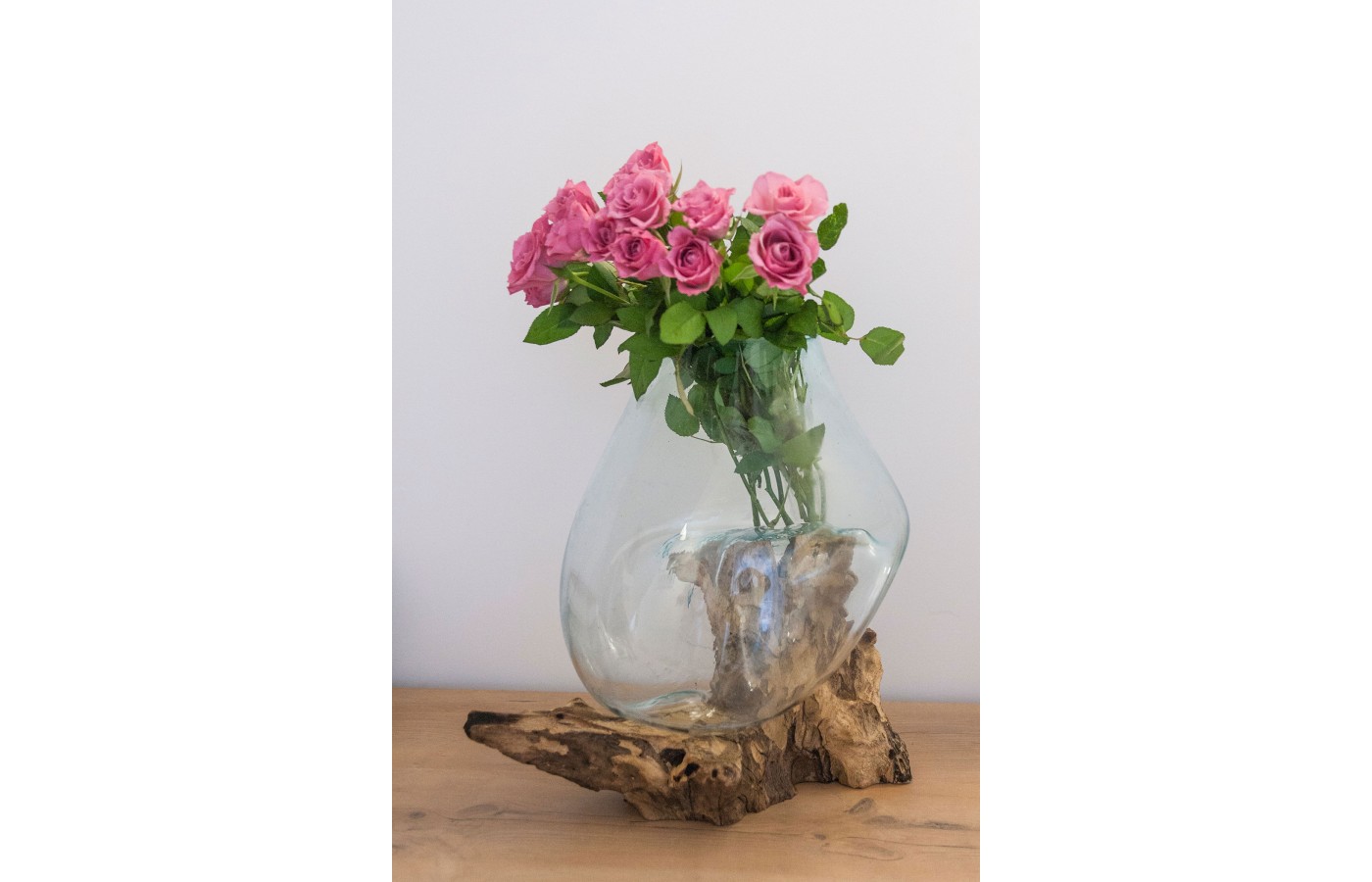 Cast glass vase on teak root