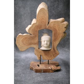 Buddha head surrounded by teak wood