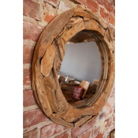 A mirror in a teak wood frame