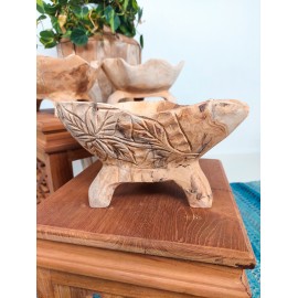 Wooden bowl on three legs with carvings