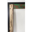 A unique mirror frame made of antiqued wood