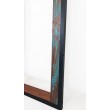 A unique mirror frame made of antiqued wood